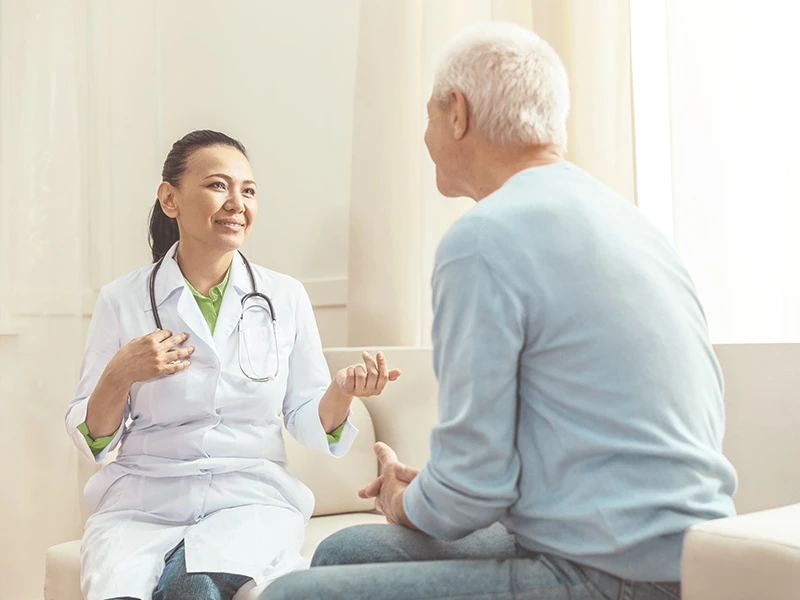 Doctor chats with patient