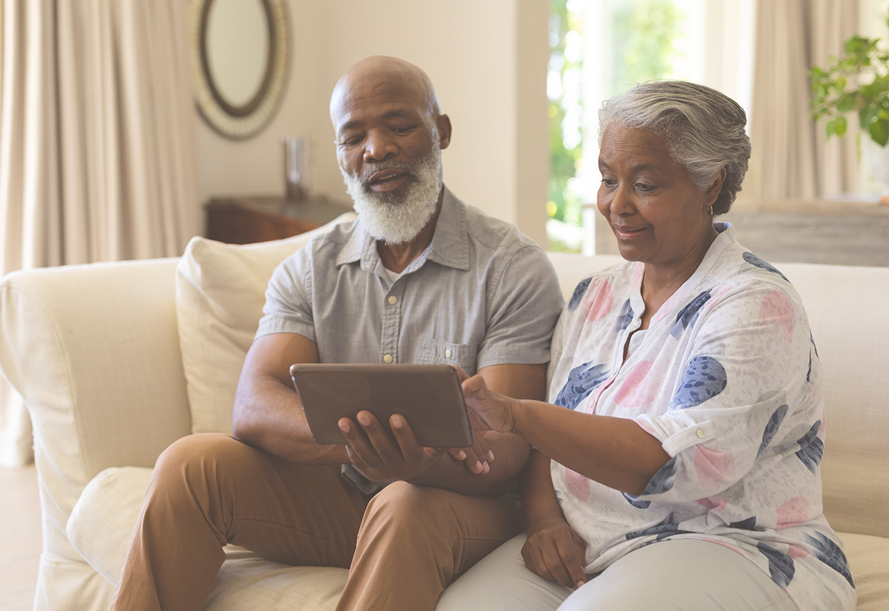 Couple looks at test results on tablet