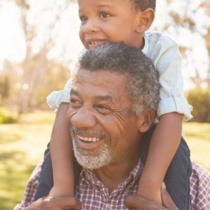 A person carrying a child on their shoulders