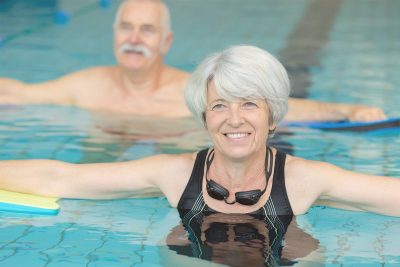 Seniors exercising in a pool